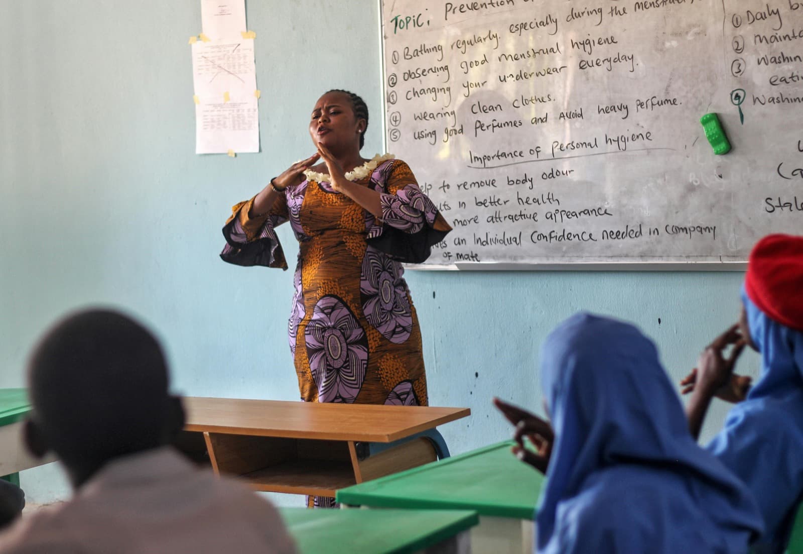Teacher with students listening in class