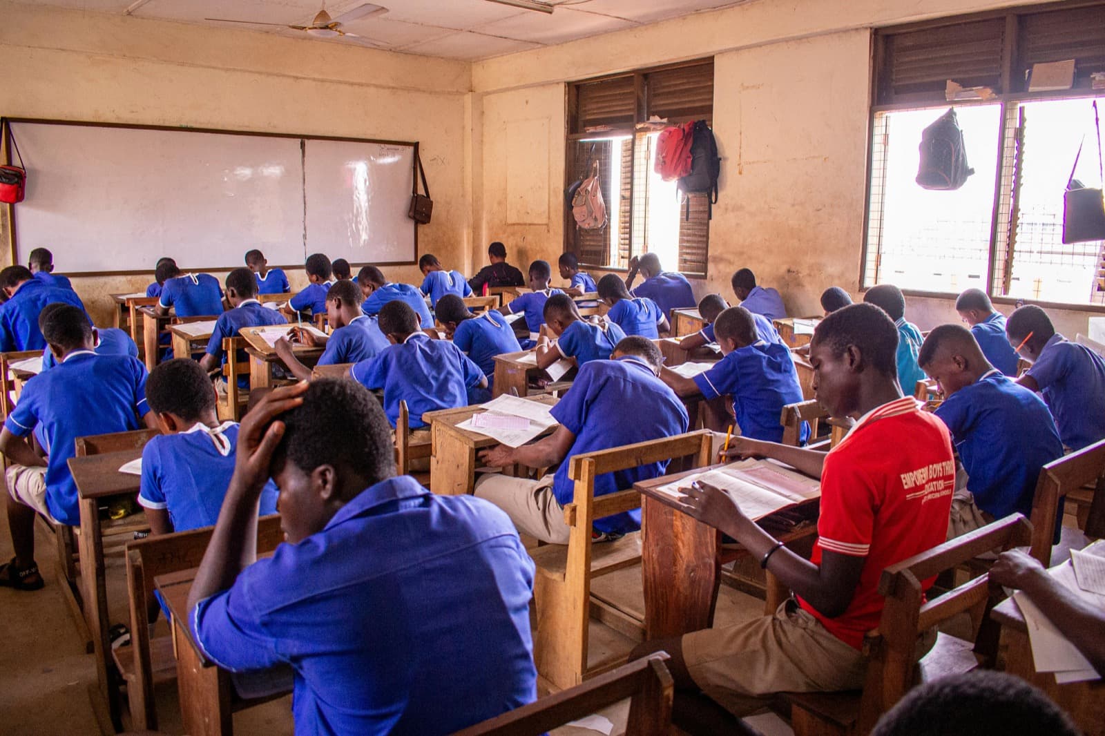 Students reading notes in class